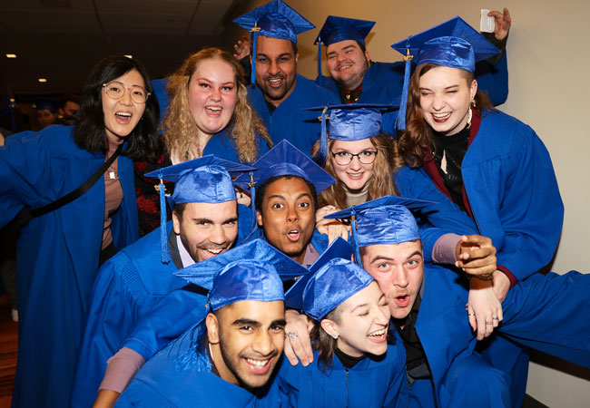 Photo of group of graduates in their caps and gowns