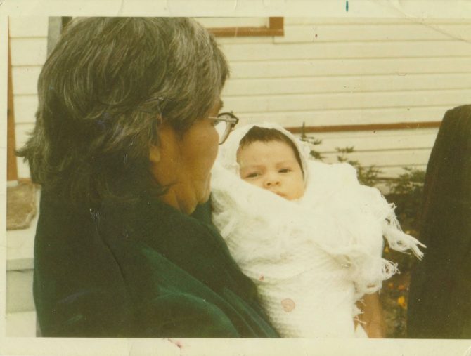 Ross is pictured as a baby with his maternal grandmother