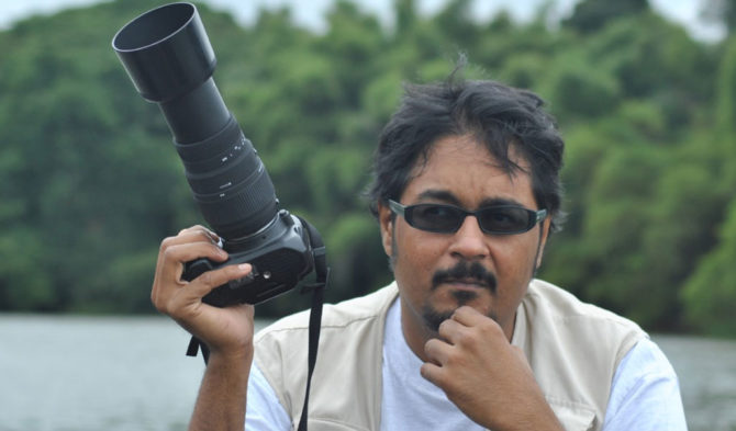 Image of Shreeharsha Rao, holding camera.