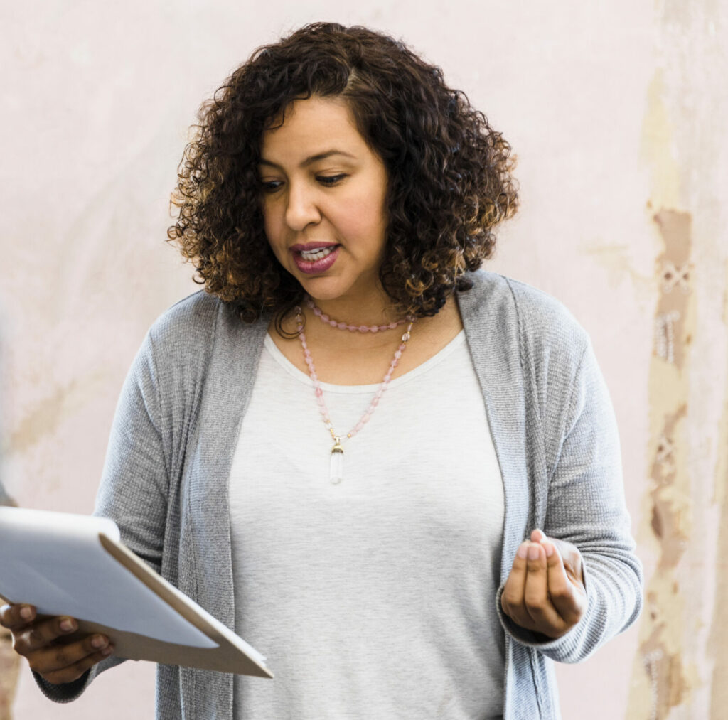 Actor reading lines, preparing to do monologue.