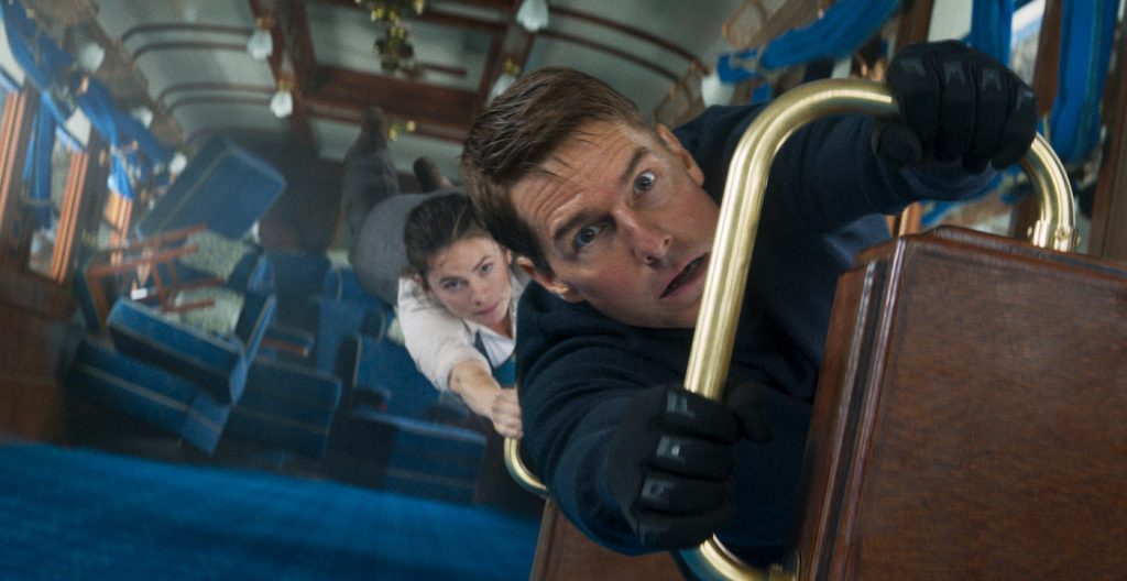 Image of Tom Cruise dangling inside train in Mission: Impossible Dead Reckoning Part One