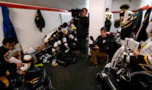 Steven Hoffner filming in The Cannons' locker room